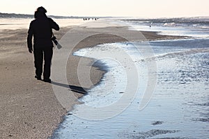 Lonely photographer at Ameland Island, Netherlands photo