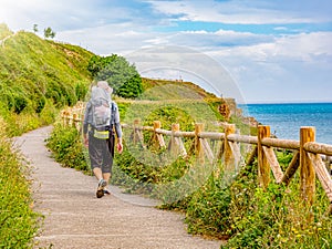 Lonely Pilgrim with backpack walking the Camino de Santiago in Spain photo
