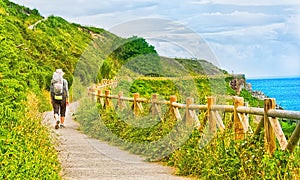 Lonely Pilgrim with backpack walking the Camino de Santiago in S photo