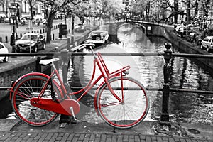 Lonely red bike on the bridge