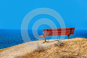 Lonely red painted bench with nice view on the Mediterranean Sea, Ashkelon, Israel