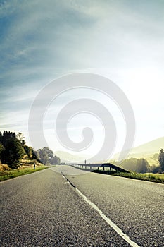 Lonely road at the dawn, misty morning at the black forest