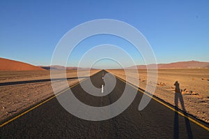 Lonely Road in dry pan of Sossusvlei Namib Naukluft National Park