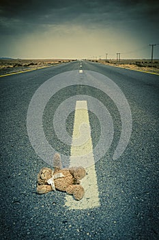 lonely road and teddy bear