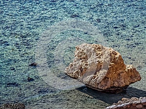 Lonely rock in the clear water of the Red Sea in Sharm El Sheikh, Egypt