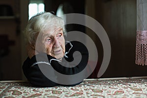 Lonely sad old woman portrait.