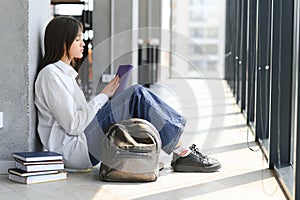 Lonely sad schoolgirl while all her classmates ignored her. Social exclusion problem. Bullying at school concept.