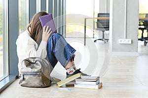 Lonely sad schoolgirl while all her classmates ignored her. Social exclusion problem. Bullying at school concept.