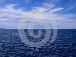 Lonely sailboat on the ocean