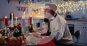 Lonely senior man at festive table for Christmas