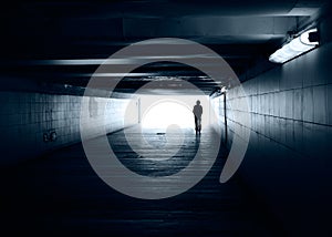 Lonely silhouette in a subway tunnel