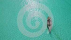 Lonely sitting near shore at noon, aerial