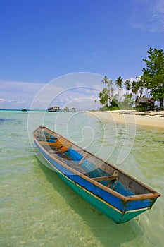 Lonely small boat at beautiful beach