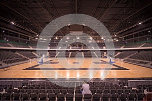 Lonely spectator in sports hall photo