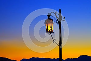 Lonely street lantern at sunset.