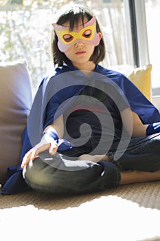 Lonely superhero child finding inner peace into thyself with mindfulness