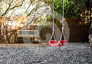 Lonely swings hanging on rope