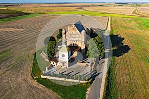 A lonely temple in the middle of a wheat field. Shot from above.