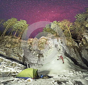 Lonely tent athlete under the icefall