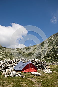 Lonely tent sorrounded by rocks