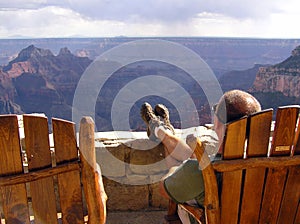 Lonely tourist looking at Grand Canyon North Rim