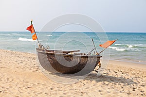 Lonely traditional vietnamese boat on the beach