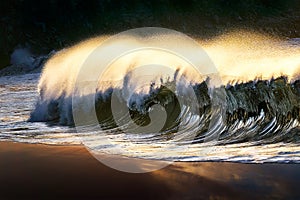 lonely wave breaking at beach