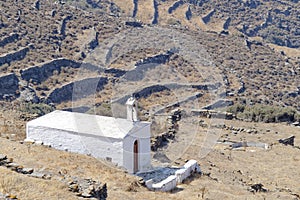 Lonely white church on mountain slopes