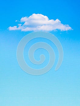 Lonely white cloud above blue sky background, prefabricated for design. Copy space_