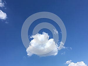 Lonely white cloud in the blue sky. Abstract natural wallpaper.