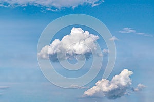 Lonely white cumulus cloud in a blue spring sky. Nature background