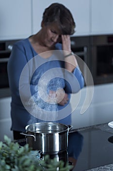 Lonely widow cooking