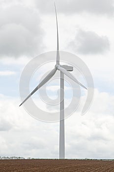 Lonely wind turbine in farm fields, South Yorkshire, UK