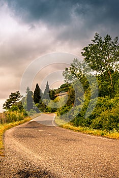 A lonely winding road on the hills of Tuscany - 2