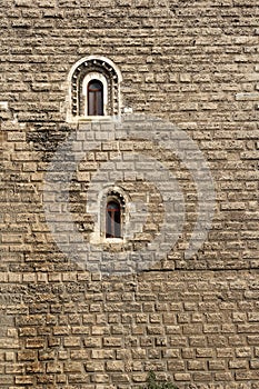 Lonely windows on a big monastery