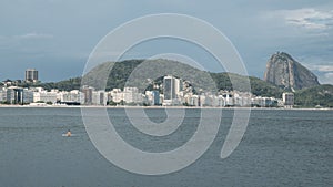 Lonely woman adrift overlooking Copacabana Beach, Rio de Janeiro