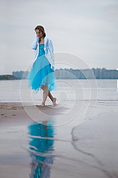 Lonely woman on the beach