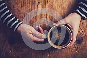 Lonely woman drinking coffee in the morning