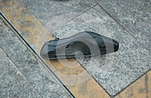 LONELY WOMAN SHOE ON THE STREET -