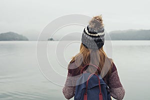 Lonely woman standing absent minded