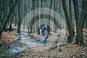 Lonely Woman Standing in Forest