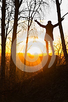 Lonely woman at sunrise. Solitude concept, alone in forest