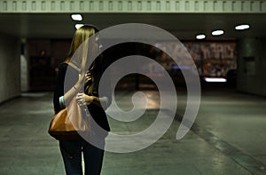 Lonely woman in the underpass