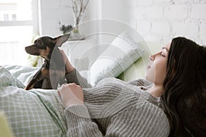 Lonely woman wake up with dog