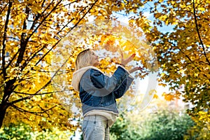 Lonely woman walk alone at autumn park, lifestyle