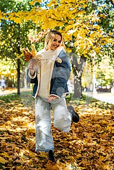 Lonely woman walk alone at autumn park, lifestyle