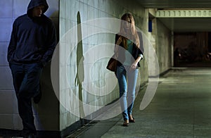 Lonely woman walking at night