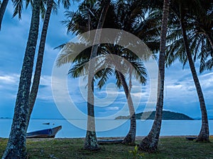 Lonely wooden boat on the beach after rain