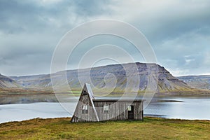 Lonely wooden hut in Iceland, west fjords landscape