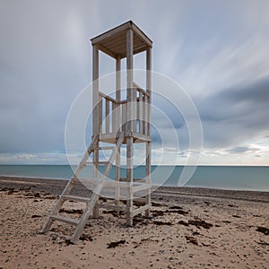 Lonely wooden lifeguard tower on the seashore